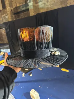 Top hat created for Baron Samedi, inspired by an Undercover runway dress and reinterpreted as a sculptural costume piece. Costume design by Olya Chuk.