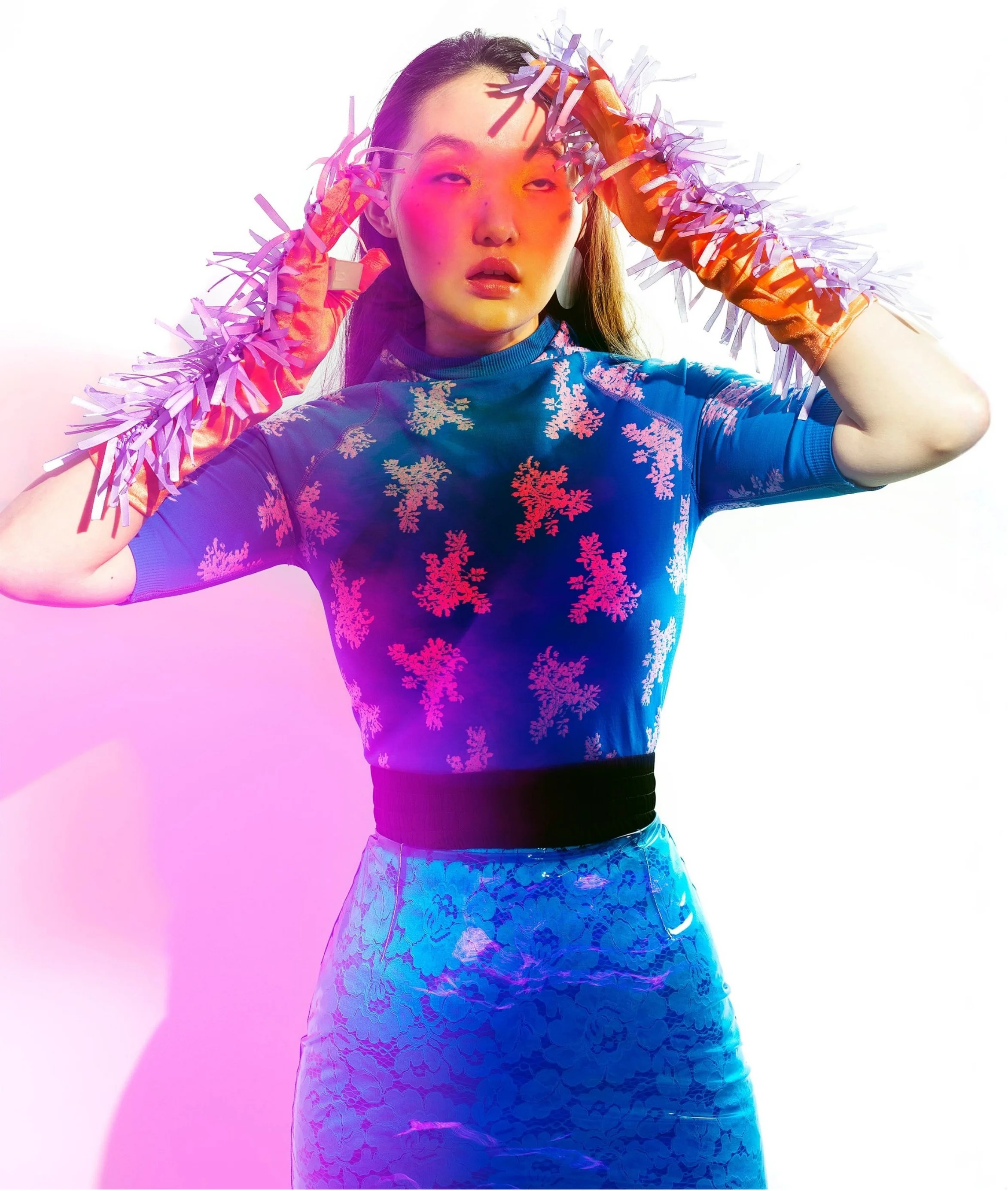 Model wearing a lace and silicone look against a bright background, styled by Olya Chuk