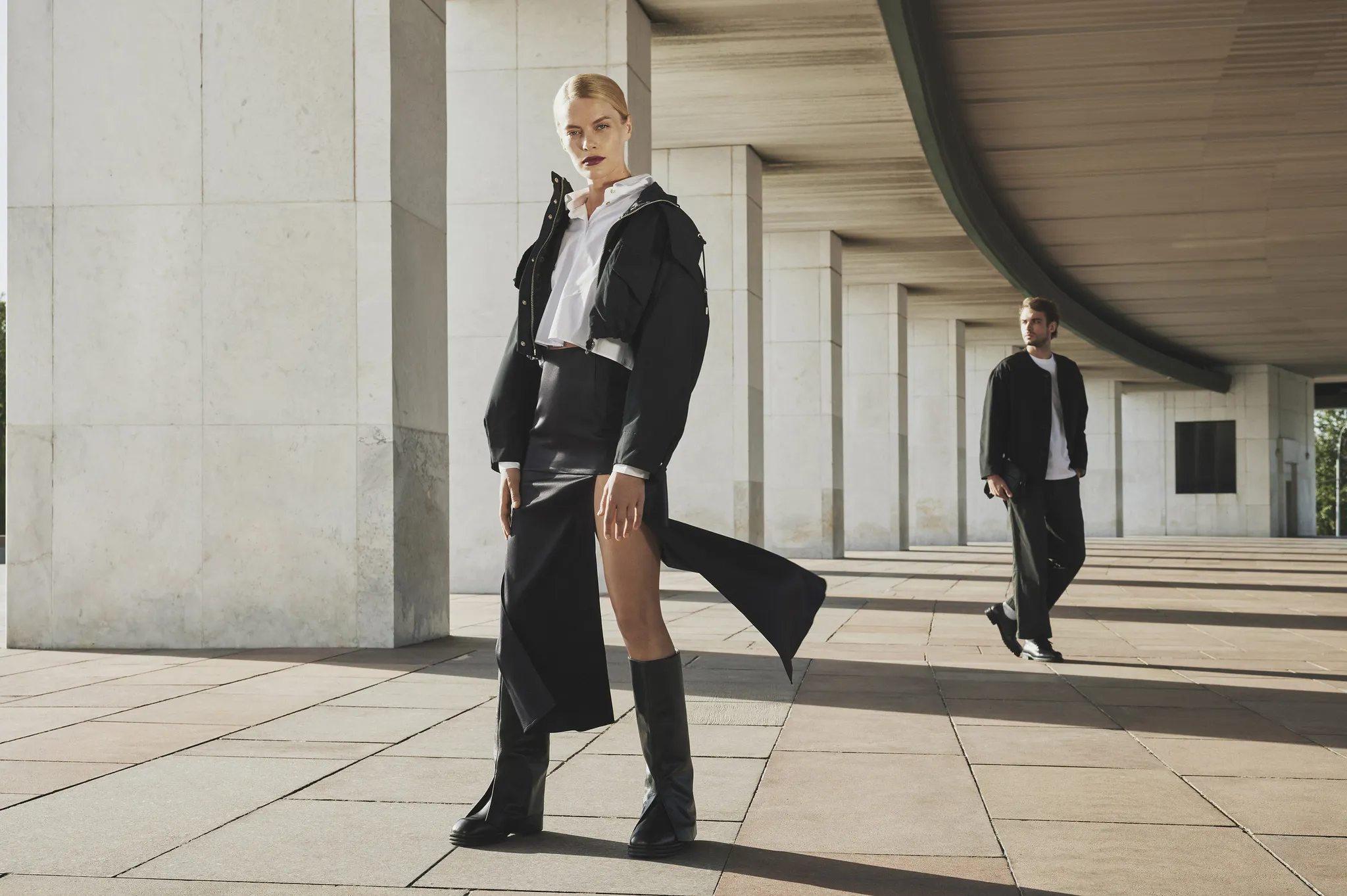 Men's and women's footwear lookbook featuring the same shoe styles across both genders, with models in coordinated black tailoring inspired by Prada's aesthetic, styled by Olya Chuk.