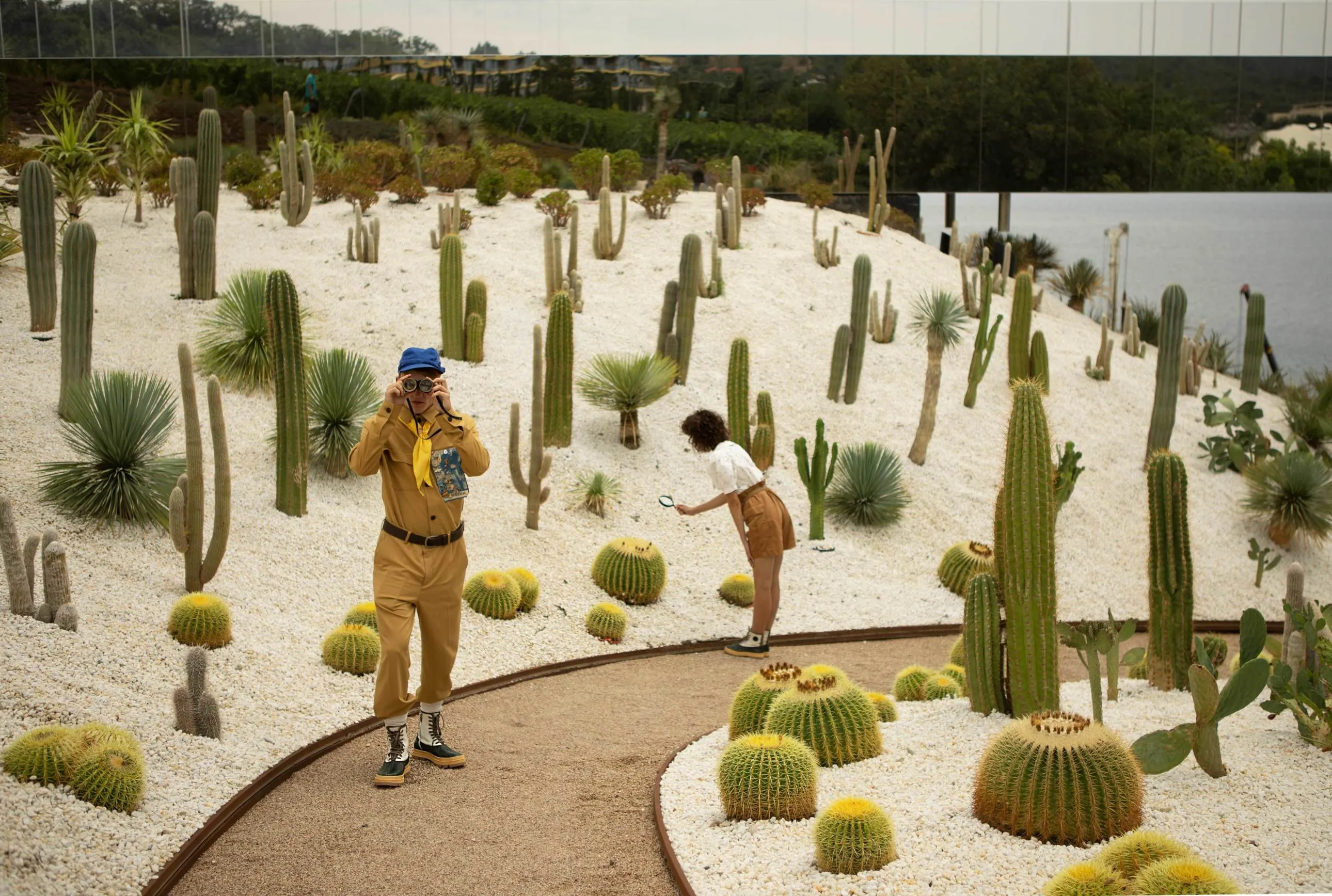 Models wearing Miu Miu and Carhartt WIP looks in a fashion editorial inspired by the visual world of Wes Anderson.