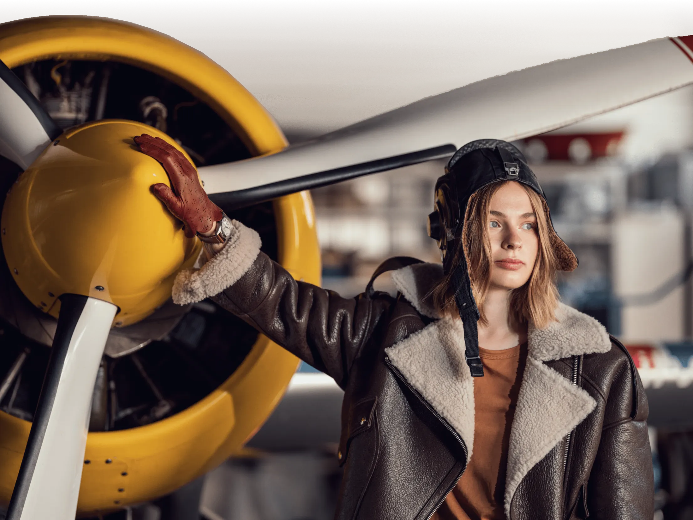 Real-life aviator photographed for a Longines × Esquire advertorial, wearing a vintage Japanese sheer aviator jacket.